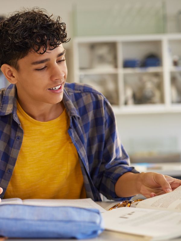 Student studying maths and science with tutor support